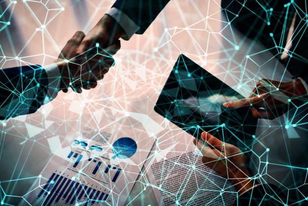 Managers shaking hands over business plans